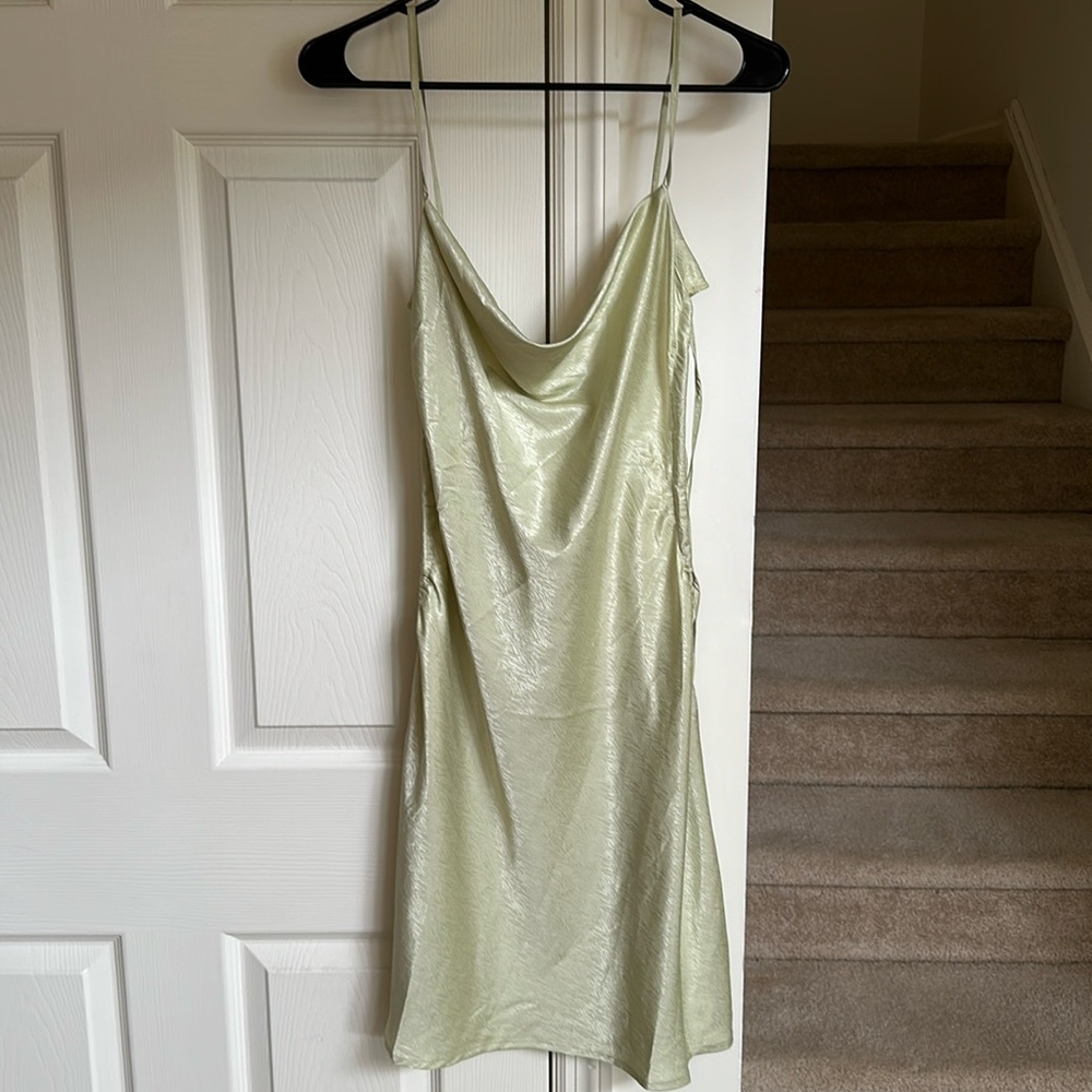 Bubbles and lace mini dress. Color Sage. Adjustable ties on both sides